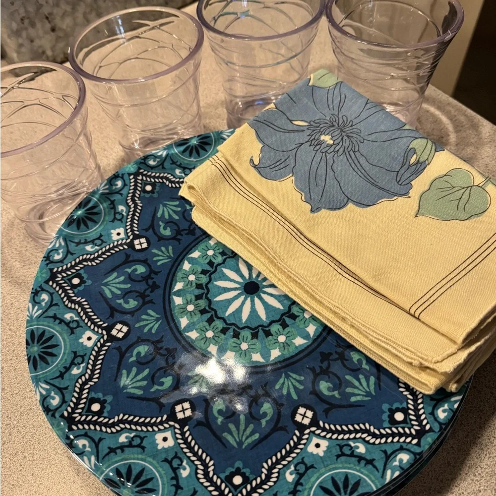 Blue Patterned Plates and Glasses with‎ Floral Napkins
